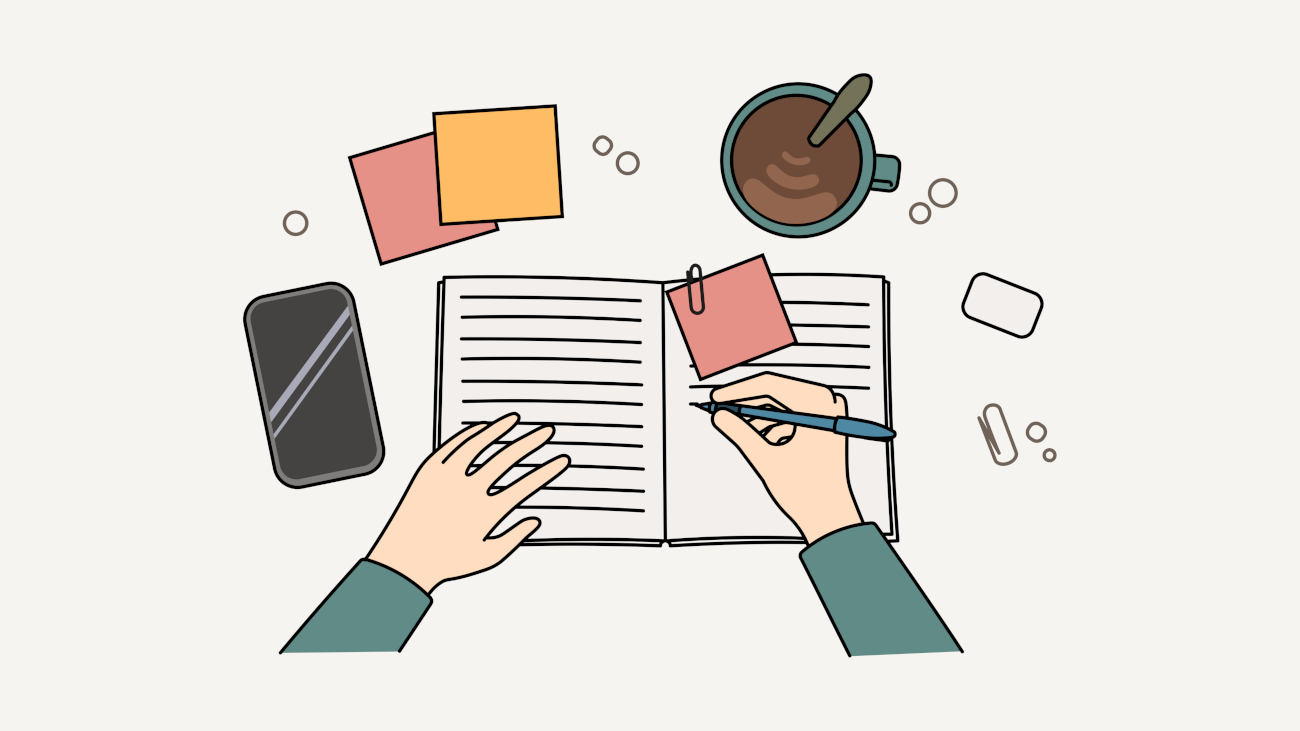 Unas manos anotan cacofonías en una libreta