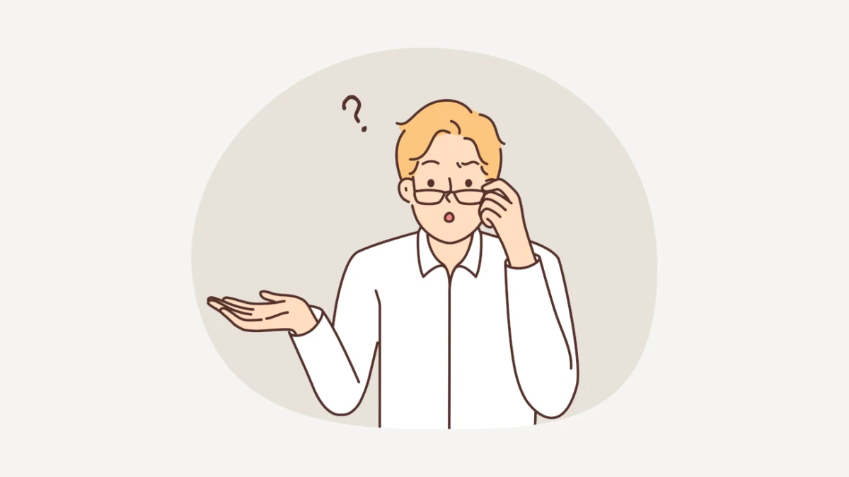 Un hombre con anteojos duda sobre cuánto se cobra por revisar una tesis